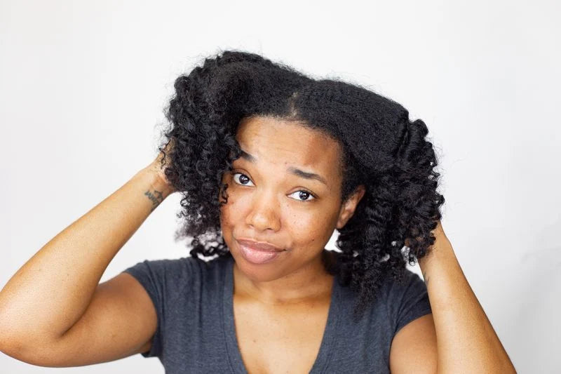 2. Dryness and frizz aren't a trait of coily hair. They're a sign something is missing.